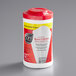 A white container of Sani Professional No-Rinse Sanitizing Multi-Surface Wipes with a red lid.