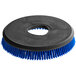 A circular black and blue Nilfisk disc scrub brush with blue bristles.