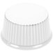 A white super white china fluted ramekin on a white surface with a white circle.