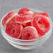 A bowl of Kervan Gummy Cherry Rings on a gray surface.