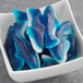 A bowl of Kervan Gummy Sharks on a counter.