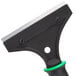 A close up of an Unger ErgoTec scraper with a black and green handle.