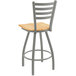 A Holland Bar Stool Jackie ladderback swivel bar stool with a wooden seat and metal back.