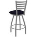 A black and silver Holland Bar Stool ladderback swivel counter stool with a blue cushion.