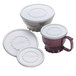A group of white Dinex plastic lids.