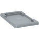 A gray plastic Quantum lid on a grey plastic tray.