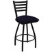 A black Holland Bar Stool ladderback swivel bar stool with a blue seat.