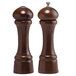 A close-up of a round brown Chef Specialties Windsor Walnut pepper mill with a matching salt shaker.