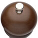 A Chef Specialties Windsor walnut pepper mill with a silver knob.