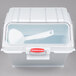 A white Rubbermaid ingredient storage bin with a sliding lid and scoop inside.