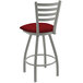 A Holland Bar Stool Jackie ladderback counter stool with red cushion and anodized nickel frame.