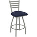 A Holland Bar Stool ladderback counter stool with a blue padded seat and back.