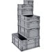 A stack of Quantum heavy-duty grey plastic crates.