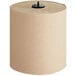A roll of brown Tork paper towels with a black handle.
