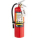 A Badger Advantage dry chemical fire extinguisher with a white tag.