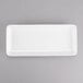 A white rectangular porcelain tray with a small handle.