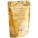 A brown bag of Davidson's Organic Ginger Peach Loose Leaf Tea with text and leaves.