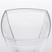 A clear plastic square wine glass with a triangular design.