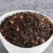 A bowl of Davidson's Organic Spiced Peach loose leaf tea.