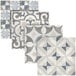 A white display of blue and grey Abert tiles with different patterns.