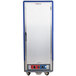 A blue Metro C5 heated holding and proofing cabinet with a stainless steel body and wheels.