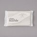 A white marble bar of Dial soap in a white package with black text.