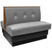 An American Tables & Seating gunmetal double booth with a button tufted back.