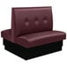 An American Tables & Seating red upholstered double booth with a 3-button tufted back and black base.