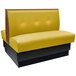 An American Tables & Seating yellow booth with black end caps and tufted back.