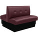 An American Tables & Seating red leather double booth with a tufted back and black base.