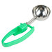 A Zeroll green and silver ice cream scoop with a green handle.