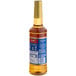 A Torani Vanilla Bean flavoring syrup 750 mL plastic bottle with a blue label.