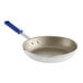 A Vollrath Wear-Ever aluminum non-stick fry pan with a blue and silver handle.