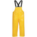 A yellow Tingley Iron Eagle rain overall with black straps.