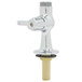 A silver Equip by T&S deck mount faucet with a gold nut.