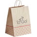 A brown Bagcraft paper shopping bag with "Meals to Go" printed in red.