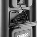 A black and grey Cambro Pro Cart Ultra with a black cord inside.