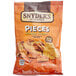 A bag of Snyder's of Hanover Cheddar Cheese Pretzel Pieces on a table.