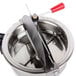 A stainless steel Galaxy kettle for popcorn machines with a red handle.