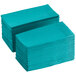 A stack of teal paper napkins.