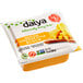 A package of Daiya Vegan Cheddar Cheese blocks on a white background.