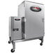 A large silver metal Pro Smoker 100SS barbecue machine on wheels with a door.