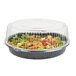 A WNA Comet clear plastic high dome lid on a plastic salad container.