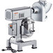 An Avantco commercial stand mixer with metal attachments and a round bowl.