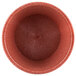 A close up of a red polyethylene ramekin.