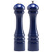 Two cobalt blue salt and pepper shakers with silver caps.