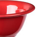 A close up of a red Carlisle Sierrus nappie bowl with a white rim.