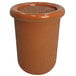 A brown round concrete cigarette ash receptacle with a round top.