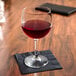 A Libbey Bristol Valley wine glass filled with red wine on a table