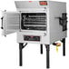 A large stainless steel Southern Pride rotisserie smoker with a door open.